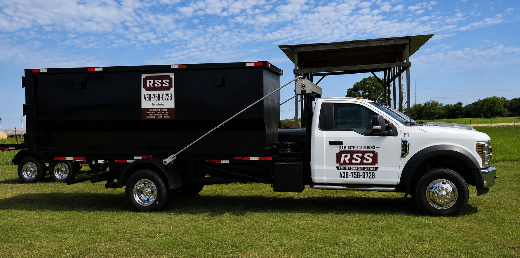 Ram Site Solutions roll-off truck and dumpster on site